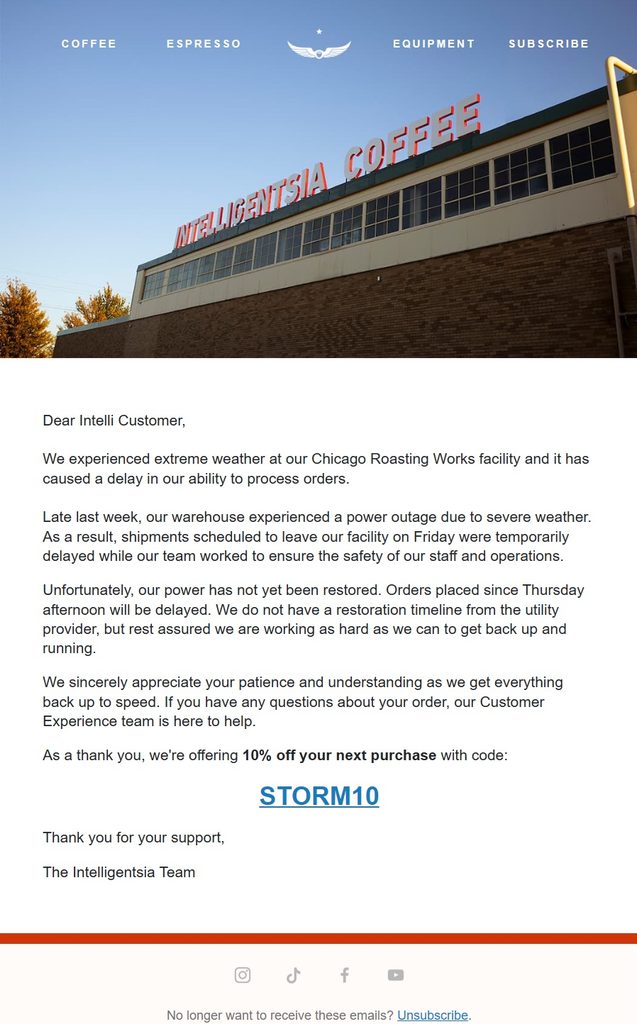 Intelligentsia Coffee shipping delay email explaining that severe weather and a power outage at its Chicago roasting facility have delayed order processing, with customer support guidance and a 10% discount code for a future purchase.