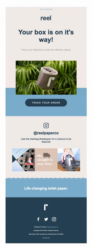 Reel shipping confirmation email announcing that the customer’s box is on its way, with a Track Your Order button, branded product imagery, and a social media prompt encouraging customers to share their experience on Instagram using the #reelpaper hashtag.